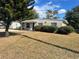 Charming single-story home with a well-maintained lawn and mature landscaping at 905 Governors Ave, Orlando, FL 32808