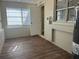 Spacious utility room features laminate floors, a door and a water heater at 905 Governors Ave, Orlando, FL 32808