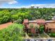Aerial view of complex with lush greenery, palm trees, and well-maintained landscaping at 976 E Michigan St # A, Orlando, FL 32806