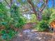 Lush backyard with mature trees and a wood fence at 976 E Michigan St # A, Orlando, FL 32806