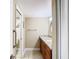 Well-lit bathroom featuring double sinks and a granite countertop at 976 E Michigan St # A, Orlando, FL 32806