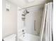 Bathroom showing tile surround, shower head and curtain at 976 E Michigan St # A, Orlando, FL 32806