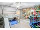 Themed bedroom featuring carpeted flooring and a bunk bed with slide and trampoline at 976 E Michigan St # A, Orlando, FL 32806