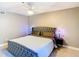 Comfortable bedroom with a ceiling fan, soft carpet, and accent lamps at 976 E Michigan St # A, Orlando, FL 32806