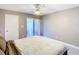 Bedroom with a ceiling fan and sliding glass door to the outdoor space at 976 E Michigan St # A, Orlando, FL 32806