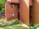 Exterior view of a well-maintained condo with tidy landscaping and inviting entrance at 976 E Michigan St # A, Orlando, FL 32806