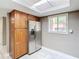 Bright kitchen with wood cabinets, a stainless steel refrigerator, and lots of natural light at 976 E Michigan St # A, Orlando, FL 32806