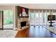 Bright living room with fireplace, modern painting, and access to the outdoors at 976 E Michigan St # A, Orlando, FL 32806