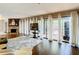 Bright living room featuring a stone fireplace and large windows with sheer curtains at 976 E Michigan St # A, Orlando, FL 32806