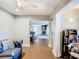 Comfortable living room featuring wood-style flooring, with connecting views to another room at 976 E Michigan St # A, Orlando, FL 32806