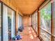 Enclosed patio showcasing tile floors and views of the outdoors at 976 E Michigan St # A, Orlando, FL 32806