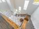 A birds eye view of the grand two-story foyer with staircase, modern railings, and natural light at 985 Jack Nicklaus Ct, Kissimmee, FL 34747