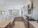 Open concept kitchen with sleek countertops, stainless appliances and eat in breakfast bar at 985 Jack Nicklaus Ct, Kissimmee, FL 34747