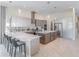 Bright kitchen featuring sleek cabinets, stainless appliances, and a large center island at 985 Jack Nicklaus Ct, Kissimmee, FL 34747