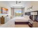 Spacious main bedroom featuring tray ceiling, access to balcony and a TV for relaxing at 985 Jack Nicklaus Ct, Kissimmee, FL 34747