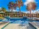 Stunning in ground pool and jacuzzi with custom pool decking and a mature privacy landscape at 985 Jack Nicklaus Ct, Kissimmee, FL 34747