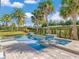 Inviting pool and spa with a well manicured yard and tall palm trees at 985 Jack Nicklaus Ct, Kissimmee, FL 34747