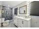 Modern bathroom features marble walls, mosaic shower, and white vanity with double sinks at 1004 Sunwood Lane Ln, Orlando, FL 32807