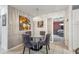 Charming dining area with a modern chandelier and elegant decor leading into the main bedroom at 1004 Sunwood Lane Ln, Orlando, FL 32807