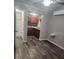 Hallway view into the bathroom and kitchen, showing the layout of the living spaces at 1004 Sunwood Lane Ln, Orlando, FL 32807