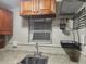 This is a kitchen with a sink, window and cabinets at 1004 Sunwood Lane Ln, Orlando, FL 32807