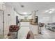 Bright kitchen and dining area featuring white cabinetry, stainless steel appliances, and granite countertops at 1004 Sunwood Lane Ln, Orlando, FL 32807