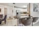 Open kitchen layout with a breakfast bar, white cabinetry, and stainless steel appliances at 1004 Sunwood Lane Ln, Orlando, FL 32807