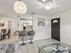 Bright living room leading to an open dining area and kitchen featuring a stylish pendant light at 1004 Sunwood Lane Ln, Orlando, FL 32807