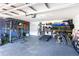 Organized garage featuring workout equipment, a treadmill, storage shelves, and ample space at 10226 Vickers Ridge Dr, Orlando, FL 32829