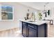 Kitchen island with a white countertop and gold hardware at 10226 Vickers Ridge Dr, Orlando, FL 32829