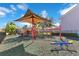 Community playground featuring a covered play structure and a seesaw for outdoor fun at 10226 Vickers Ridge Dr, Orlando, FL 32829