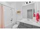 Clean bathroom with a tub, shower, and modern vanity at 10358 Spring Arbor Ln, Winter Garden, FL 34787