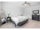 Bright bedroom featuring hardwood floors, closet space, and neutral decor at 10358 Spring Arbor Ln, Winter Garden, FL 34787