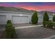 Well-maintained townhouse exterior featuring a driveway and landscaping at 10358 Spring Arbor Ln, Winter Garden, FL 34787