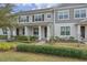 Charming two-story townhome with well-manicured lawn and inviting front porch at 10358 Spring Arbor Ln, Winter Garden, FL 34787