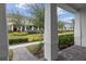 Inviting front porch view of townhomes with landscaped lawns and brick walkways at 10358 Spring Arbor Ln, Winter Garden, FL 34787