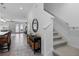 Bright hallway with stairway, console table, and view into open living spaces at 10358 Spring Arbor Ln, Winter Garden, FL 34787