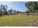 Large grassy backyard with a wooden fence at 1041 Vihlen Rd, Sanford, FL 32771