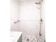 Modern shower with marble wall and a shower head at 1041 Vihlen Rd, Sanford, FL 32771