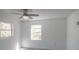 Sunlit bedroom with two windows and a ceiling fan at 1041 Vihlen Rd, Sanford, FL 32771