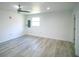 An empty bedroom featuring light wood flooring, neutral walls, and a ceiling fan at 1041 Vihlen Rd, Sanford, FL 32771