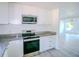 Bright modern kitchen features stainless steel stove and microwave at 1041 Vihlen Rd, Sanford, FL 32771