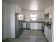 Modern kitchen features stainless steel appliances and granite countertops at 1041 Vihlen Rd, Sanford, FL 32771