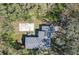 An aerial view of the house with backyard with surrounding trees at 1125 E Hubbard Ave, Deland, FL 32724