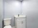 Modern powder room with new vanity, lighting, and fixtures at 1125 E Hubbard Ave, Deland, FL 32724