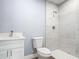 This bathroom includes tiled floors, a toilet, a sink, and a shower with tiled walls at 1125 E Hubbard Ave, Deland, FL 32724