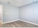 Small bedroom with wood-look floors and fresh neutral paint throughout the home at 1125 E Hubbard Ave, Deland, FL 32724