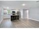 Bright and spacious kitchen featuring white cabinets, stainless steel appliances, and a stylish kitchen island at 1125 E Hubbard Ave, Deland, FL 32724