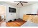 Interior view of a bedroom with hardwood floors and a ceiling fan at 1213 Cr 652, Bushnell, FL 33513