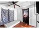 Interior view of a bedroom with hardwood floors, a mattress, and a ceiling fan at 1213 Cr 652, Bushnell, FL 33513